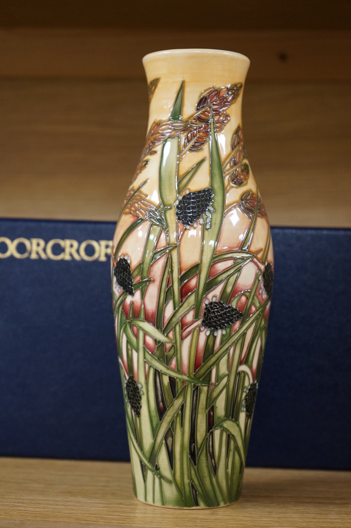 A boxed Moorcroft limited edition Savannah vase by Emma Bossons, 259/500, signed and dated 2001, 25cm